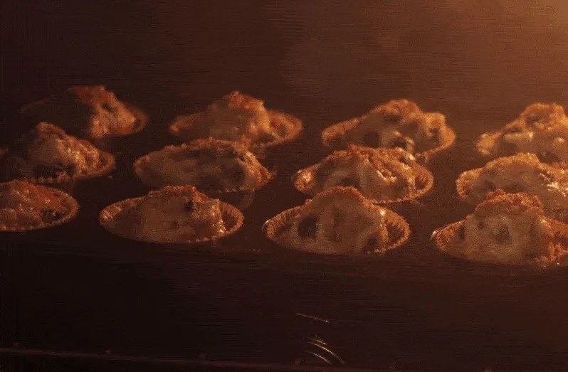 protein blueberry muffins rising in the oven