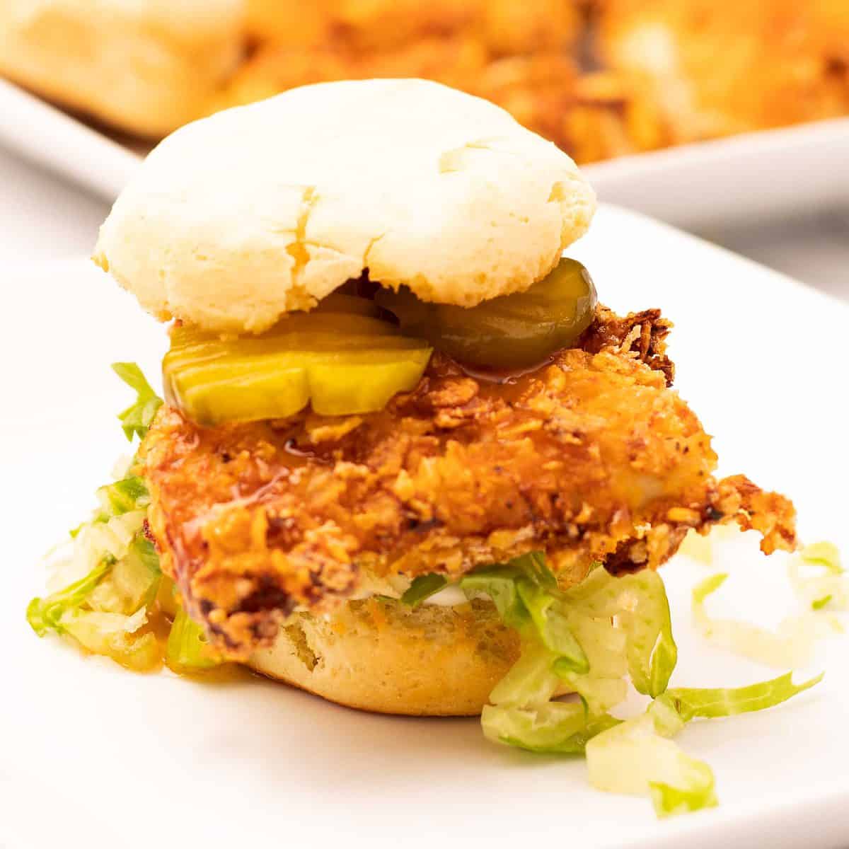 Fried chicken and biscuit sandwich with mayo, shredded lettuce, pickles, and hot honey sauce.